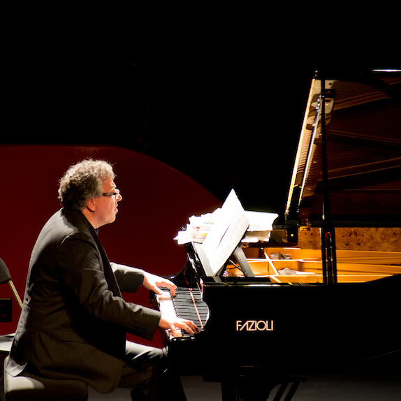 Corey Hamm playing on a Fazioli at The Fox Cabaret