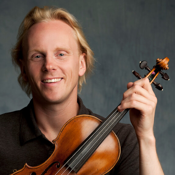 Dale Barltrop in black shirt holding violin