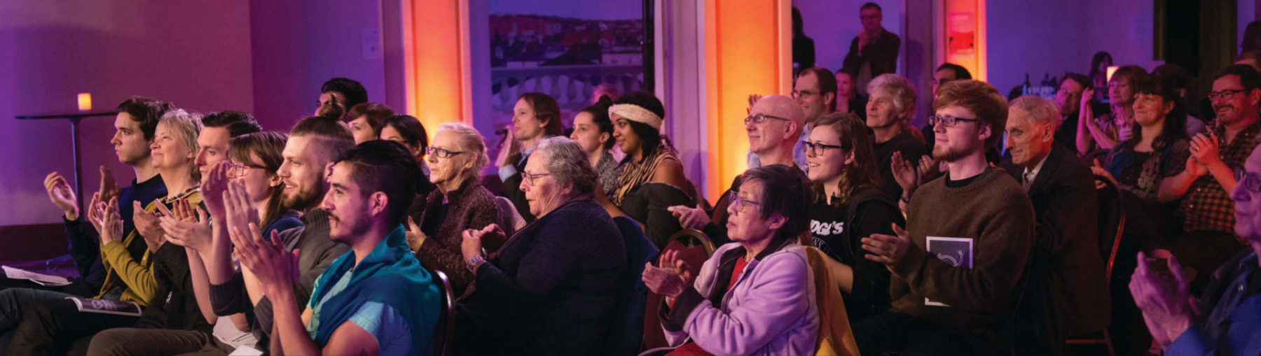 Audience clapping in their seats at Hertiage Hall