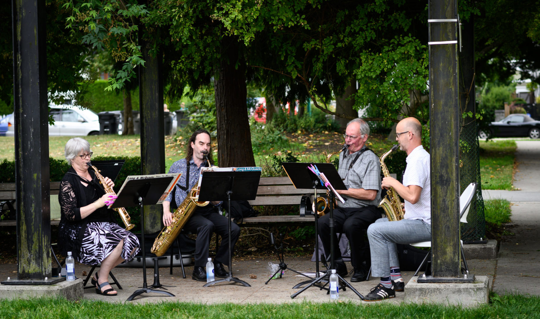Saxophilia Saxophone Quartet performing in a park