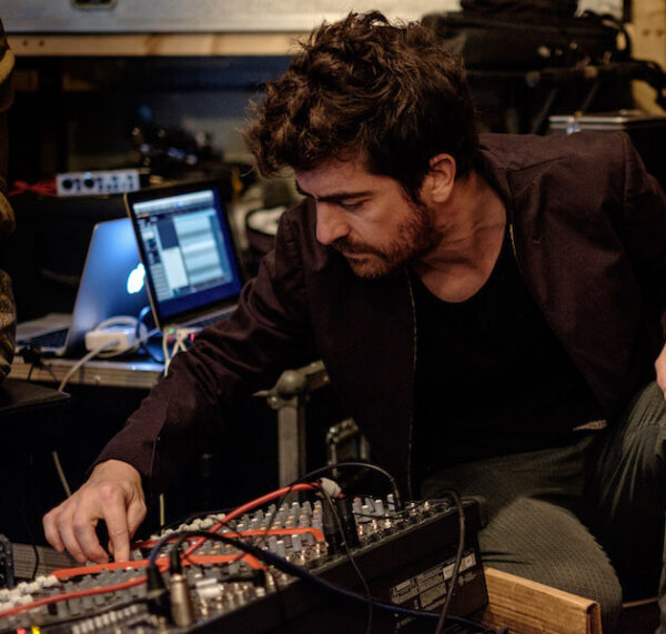 Mauricio Pauly in black working with some technical equipment