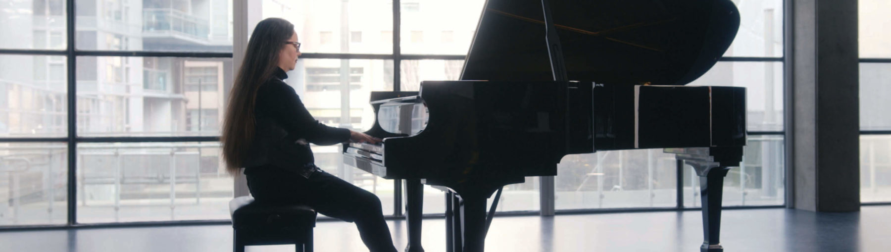 Rachel Kiyo Iwaasa playing the piano